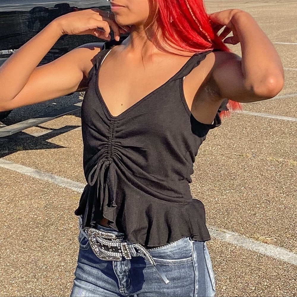 black sleeveless cinched top